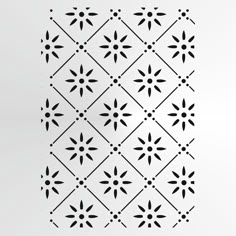 the pattern is made up of black and white shapes