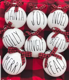 christmas ornaments with the words santa joy, noel and holly on them in black and white