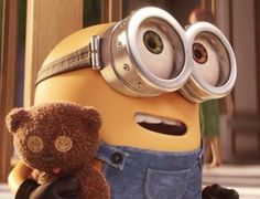 an image of a minion holding a teddy bear and looking at the camera screen