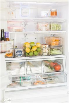 an open refrigerator filled with lots of different types of vegetables and fruit in it's door