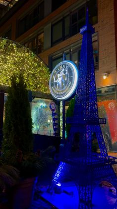 the eiffel tower is lit up in blue for the new year's eve celebration