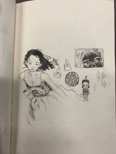 an open book with a drawing of a girl and a cat on the page next to it