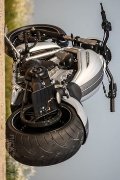 a motorcycle is suspended upside down in the air