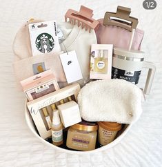 the contents of a starbucks gift basket in a white bowl on a bed with text overlay