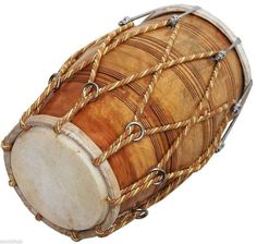 an old wooden drum with rope around it