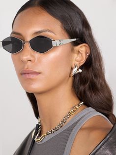 Approach your sunglasses as you do jewelry - the hexagonal silver-tone frames on CELINE Eyewear's pair will add such coolness to your complexion. The chunky arms are decorated with ‘Triomphe’ plaques and tipped in acetate. Celine Triomphe Sunglasses, Triomphe Celine, Silver Eyeglasses, Celine Eyewear, Sunglasses Celine, Denim Flats, Celine Triomphe, Rim Design, Celine Sunglasses