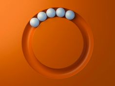 an orange circle with five white balls on it