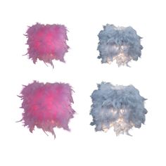 three white and pink feathers on a white background