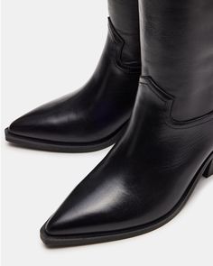 The STALLION boot is expertly crafted and designed with a pointed toe and knee-high length for a sleek and stylish look. These Western-inspired riding boots offer both durability and comfort for any riding or fashion needs. 2.5 inch heel height Size 6 measurements: 15 inch shaft circumference, 14.5 inch shaft height Size 8 measurements: 16.75 inch shaft circumference, 15.25 inch shaft height Size 10 measurements: 17.5 inch shaft circumference, 16 inch shaft height Leather upper material Textile High Leather Boots, Western Boots Women, Western Boot, Knee High Leather Boots, 5 Inch Heels, Western Boots, Riding Boots, Black Boots, Leather Boots