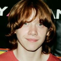 a young man with red hair and blue eyes