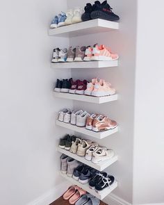 there are many pairs of shoes on the shelves