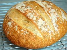 a loaf of bread sitting on top of a cooling rack