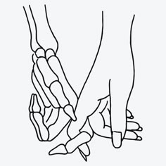 two hands holding each other with one hand on top of the other's leg