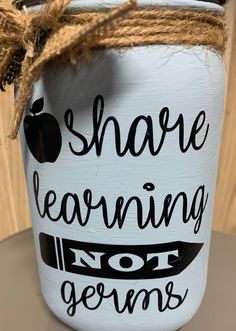 a painted mason jar that says share learning not germs