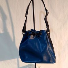 Authentic Vintage Lv Epi Leather Petit Noe In Blue With Black Trim. Very Good Vintage Condition. Light Over All General Wear. Suede Interior. Vintage Lv Denim Bag, Vintage Blue Bag With Gold-tone Hardware, Louis Vuitton Blue Bag, Bags Vintage, Louis Vuitton Bags, Black Trim, Bag Lady, Louis Vuitton, Trim