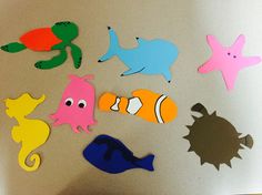 various cutouts of sea animals on a table