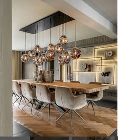 an elegant dining room with modern lighting fixtures