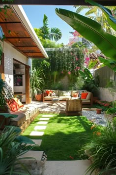 an outdoor living area with grass and plants