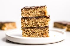 three pieces of granola bars stacked on top of each other in front of the camera