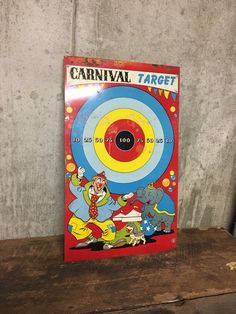 the carnival target book is sitting on top of a wooden table