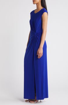 Elegant gathers meet at the waist of this event-ready maxi dress that has a touch of stretch for comfort. 56" length Slips on over head Scoop neck Short sleeves Unlined 96% polyester, 4% spandex Machine wash, tumble dry Imported Stretch Ruched Floor-length Maxi Dress, Elegant Draped Blue Maxi Dress, Elegant Blue Draped Maxi Dress, Elegant Blue Stretch Maxi Dress, Blue Spring Maxi Dress, Blue Elastane Maxi Dress For Spring, Blue Draped Maxi Dress For Formal Occasions, Blue Ruched Maxi Dress For Evening, Blue Elastane Evening Maxi Dress