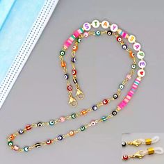 Stay Safe Beaded Necklace Eye Glasses Holder Face Mask Holder Multi-Color Beads Two Silicone Attachments Are Included D31-06 Multicolor Beaded Glasses Chains As Fashion Accessory, Multicolor Beaded Glasses Chains For Fashion Accessory, Multicolor Beaded Glasses Chain, Colorful Glass Bead Necklaces, Pink Necklace With Colorful Beads As Fashion Accessory, Pink Beaded Chain Necklace As Fashion Accessory, Pink Necklace With Colorful Beads, Beaded Mask Lanyard, Eye Glasses Holder