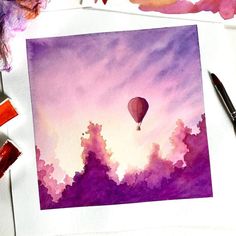 a watercolor painting of a hot air balloon in the sky