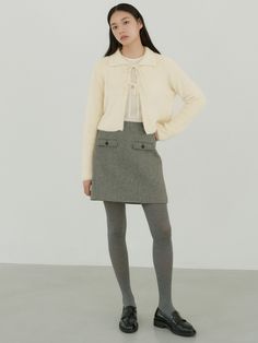 Editor's NotesThe Ladylike collection by OCTETTE showcases a modern feminine look with materials that feature a luxurious and soft touch, complemented by color schemes that highlight points of interest. It exudes a warm and cozy winter mood, embracing a modern take on feminine style- Mini skirt made of wool-blend- Classic check pattern accomodated with clean silhouette- Accented with the front pockets- Simple yet elegant design- LinedMeasurements(in.)Size: S/M- Length: 16.9 in. / 17.3 in.- Waistband width: 1.6 in. / 1.6 in.- Waist: 13.8 in. / 14.8 in.- Hip: 18.9 in. / 20.1 in.- Hem: 20.7 in. / 21.5 in.- Pocket height: 1.6 in. / 1.6 in.- Pocket width: 4.5 in. / 4.5 in.- Lining gap: 1.8 in. / 1.8 in.* Model info: height 5' 7, Bust 31, Waist 24, Hips 34Composition & Care- 65% wool, 3 Cute Work Outfits, Ladylike Style, Winter Mood, Pocket Skirt, Modern Feminine, Gray Skirt, Feminine Look, Cozy Winter, Skirts With Pockets