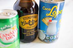 three different types of sodas on a table