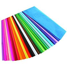 many colors of paper are laid out on top of each other