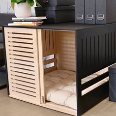 an office desk with a bed in the middle and some books on top of it