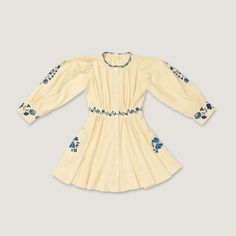 The bodice, lightly gathered around the front and back neckline, compliments intricate embroidery and mother of pearl buttons down from the neckline to the hem. Seasonal Embroidery, Corset Cover, Blair Dress, One Piece Top, Size Chart For Kids, Intricate Embroidery, Cuff Detail, Sleeve Cuff, Buy Buy Baby