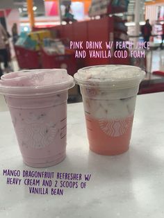 two pink and vanilla cold drinks sitting on top of a counter in a store with the words pink drink v, peach juice and vanilla cold foam