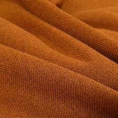 an orange fabric textured up close to the camera