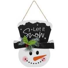 a snowman ornament hanging from a rope with let it snow written on it