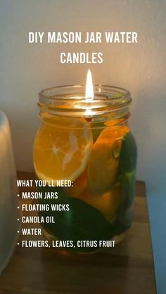 a mason jar filled with lemons and orange slices next to a lit candle that reads diy mason jar water candles what you'll need