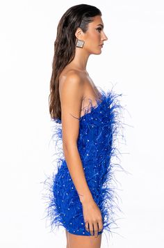 You’re about to ruffle their feathers in The AKIRA Label Primrose Strapless Embellished Feather Mini Dress In Blue! Designed from a stretchy lined mesh base fabrication, this knockout number features opulent, rhinestone-embellished feather body detailing, a strapless neckline, a curve-hugging bodycon fit, polyester inner lining, a mini length silhouette, and a tonal back zipper closure. For a fab finish, style with The AZALEA WANG Just For You Rhinestone Boot in Blue. - Shell: 92% Polyester 8% Spandex, Lining: 95% Polyester 5% Spandex - Stretchy - Imported (all measurements are approximate from size small) - 24” Chest to Hem - Model is 5’9” Product ID: 380835 Feather Mini Dress, Blue Shell, Azalea Wang, Strapless Neckline, Bridesmaid Dress, Feathers, Bridesmaid Dresses, Mini Dress, Blue