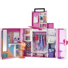 a pink doll house with clothes and accessories in the inside, on a white background