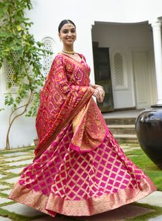 Saras the label brings you this Banarasi Lehenga in pink with pink choli and dupatta for your perfect celebrations. The set includes a stitched blouse with half sleeves style and designer neck in scoop back design and dori tie-up at the back. This Bandhani print Lehenga comes with a Bandhani print Pink Dupatta. The Flowy Banarasi silk fabric adds grace to the Lehenga Choli. Check out the photos of the product for a more detailed look.Lehenga:Fabric- Faux Banarasi silkColour- PinkPattern- Bandhan Banasari Lehenga, Pink Choli, Bandhani Lehenga, Designer Neck, Print Lehenga, Bandhani Print, Pink Dupatta, Lehenga Fabric