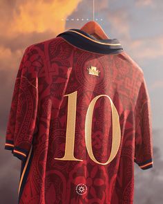 a soccer jersey with the number 10 on it is hanging in front of a cloudy sky