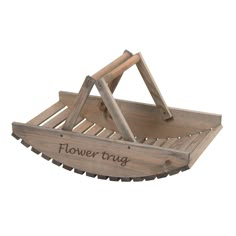 a wooden tray with flowers in it that says flower trug