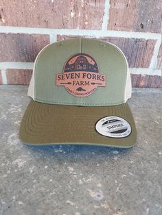 Seven Forks Farm Trucker Hat You asked for it, and here it is...Seven Forks Farm Merch! Love our Family Grown Popcorn? Then this is the hat for you! Patch is leatherette. Hat is snap back, trucker style and is spot clean only. Do not submerge in water. Retro Leather Cap, Farm Merch, Farm Hats, Farm Hat, Best Popcorn, Farm Tshirt, Popcorn Bags, Farm Barn, Snap Back