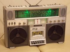 an old fashioned radio sitting on top of a couch