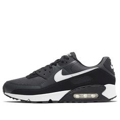 The Nike Air Max 90 Black White is a classic silhouette celebrating its 30th anniversary. The recrafted build is faithful to Tinker Hatfield’s 1990 design, utilizing a black mesh upper with dark grey leather overlays and contrasting pops of white on the various branding elements. The retro runner rides on a foam midsole with a visible Air sole unit at the heel for cushioning and comfort. (SNKR/Light/Unisex/Low Top/Non-Slip) Nike Air Max 90 Black, Air Max 90 Black, Branding Elements, Tinker Hatfield, Nike Shoes Air Max, 30th Anniversary, Nike Air Max 90, Classic Silhouette, Black Mesh