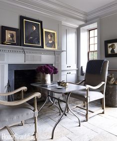 a living room filled with furniture and a fire place