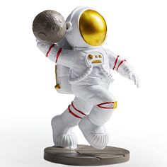 an astronaut figurine is shown on a white background