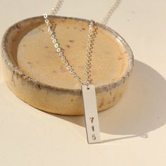 This modern bar necklace lets you represent your hood in style. We'll hand stamp your 3-digit area code on a brushed sterling silver or gold filled bar. MEASUREMENTSSpring hook clasp with 1" adjustable chainThe pendant measures 1" longMade in 14k gold fill or sterling silverHypoallergenic and waterproof Area Codes, Modern Bar, Hook Clasp, Bar Necklace, Hand Stamped, In Style, Gold Filled, Jewelry Design, Stamp