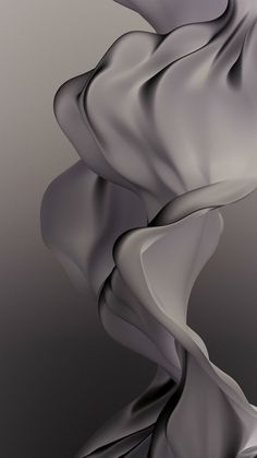 an abstract image of flowing fabric on a gray background