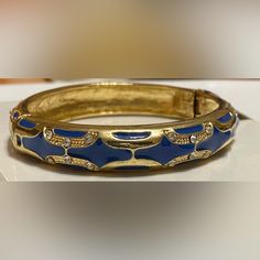 Beautiful Ornately Designed Bangle With Gold Accents. Trendy Blue Formal Jewelry, Adjustable Blue Cuff Bracelet For Party, Adjustable Blue Bracelet For Formal Occasions, Blue Metal Bracelet Jewelry, Blue Metal Jewelry With Bracelet Strap, Blue Bangle Cuff Bracelet For Party, Blue Metal Bracelet With Strap, Blue Cuff Bracelet Bangle For Formal Occasions, Blue Bangle Cuff Bracelet For Formal Occasions