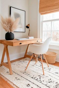 a wooden desk with two chairs next to it and a rug in front of the window